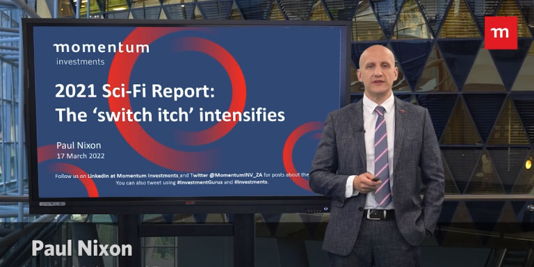 Paul Nixon standing next to a TV screen. On the screen is the 2021 sci-fi report presentation.