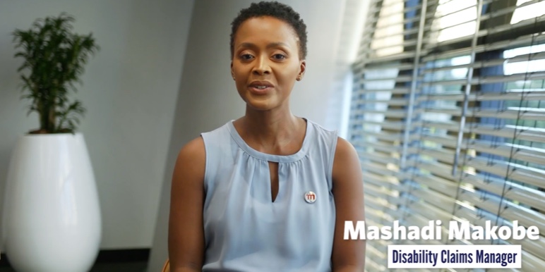 An image of Disability Claims Manager Mashadi Makobe, in conversation about critical illness benefits.