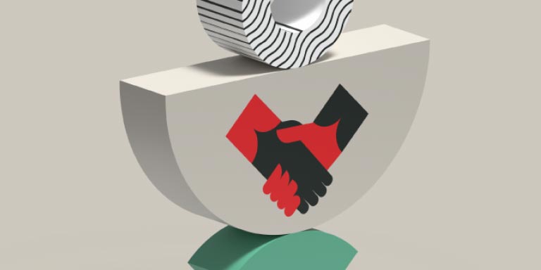 An upside down semi-circle with a picture of shaking hands on the front.