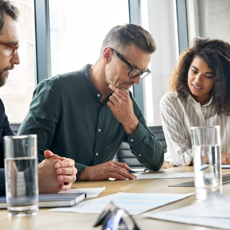 Deceased estate administrator and professional executor reviewing a deceased’s documents in the deceased estate administration process.