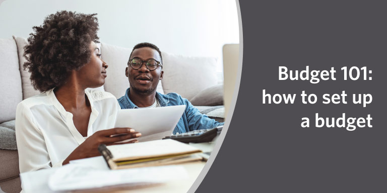 A couple sitting down together reviewing documents in a video about setting up a budget.
