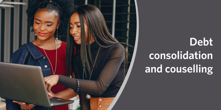 Two women reviewing financial information on a laptop in a video on debt consolidation and financial counselling.