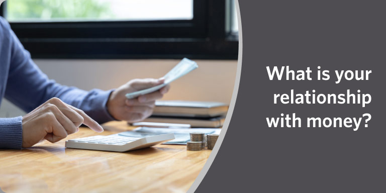 Hands with pen and calculator over paperwork in a video about financial self-awareness.