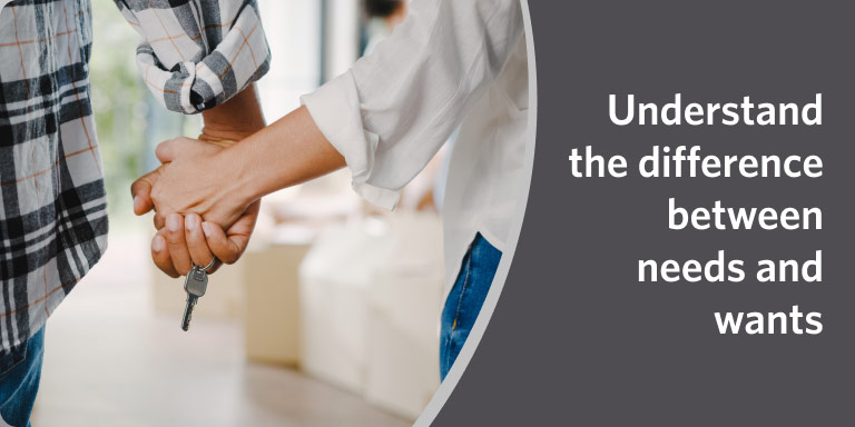 Couple holding hands while shopping in a video on the difference between needs and wants.