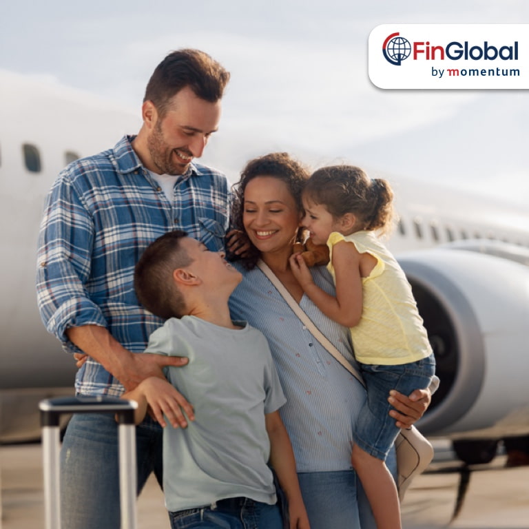 Happy expat family at an airport, supported by FinGlobal by Momentum’s financial solutions for South Africans living abroad, including tax, retirement, and cross-border money management.