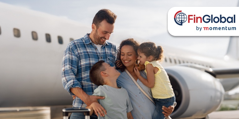 Happy expat family at an airport, supported by FinGlobal by Momentum’s financial solutions for South Africans living abroad, including tax, retirement, and cross-border money management.