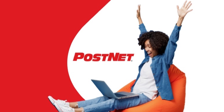 Woman on an orange beanbag, smiling at her laptop after sending her legal Will against PostNet logo background.