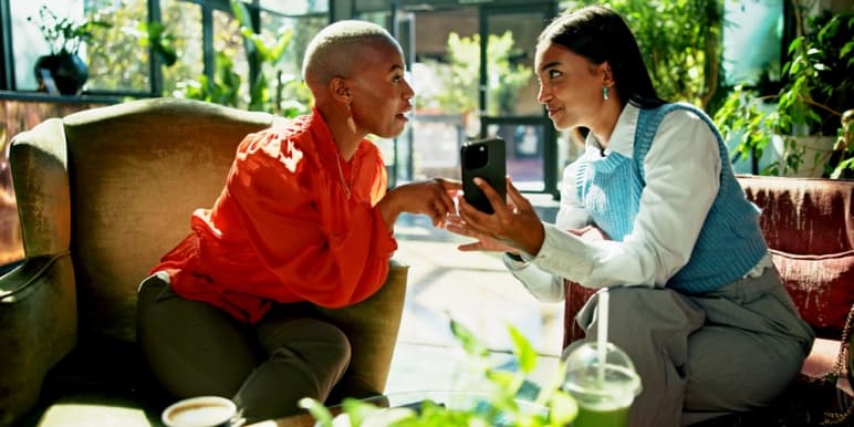 Financial adviser meeting with a lady to discuss a holistic financial plan.