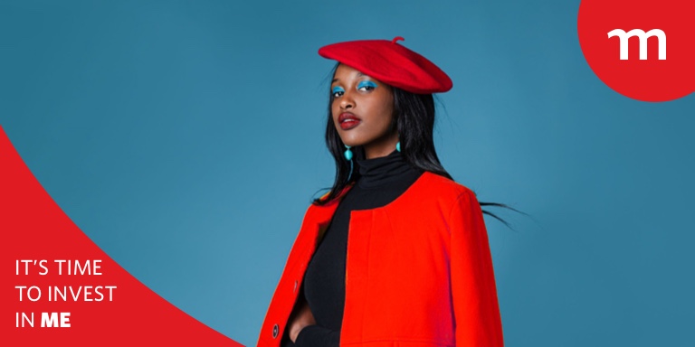 Young black women wearing a red beret and blazer looking forward boldly