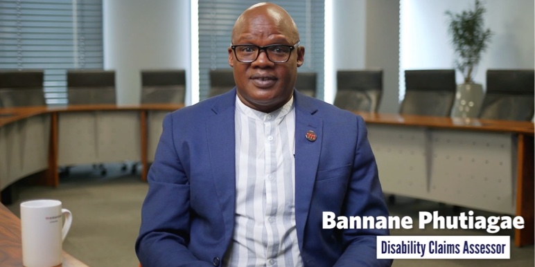 An image of Disability Claims Assessor Bannane Phutiagae, in conversation about lump sum disability benefits.