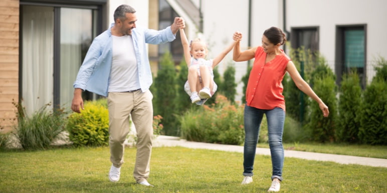A young happy family enjoying the outdoors, representing the legacy that is protected with the Momentum Estate Plan.