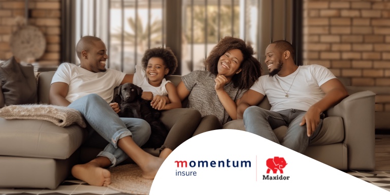 A family seated with their dog on a couch in their living room. In the background, one can see their Maxidor security gates, which give them the ultimate protection and peace of mind.