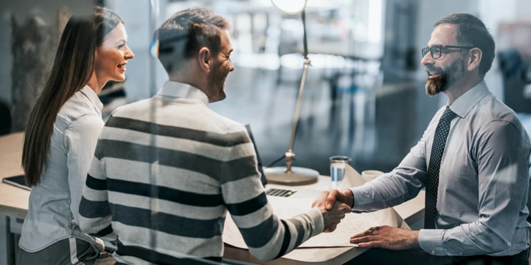 Two corporate investors meeting with a Momentum Corporate financial adviser.