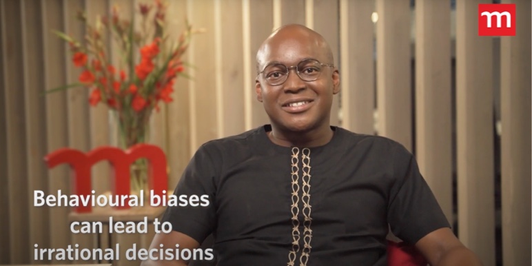 Stanley Gabriel, Momentum Savings CEO in black African print shirt, talks about financial advisers on the Money Heroes podcast.