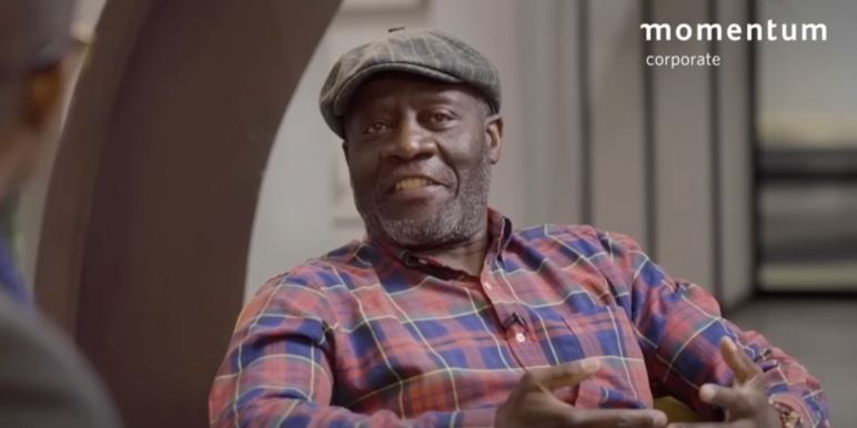 A Momentum Corporate branded image showing Phillip Matlakala in conversation for the Coffee Conversations webcast.