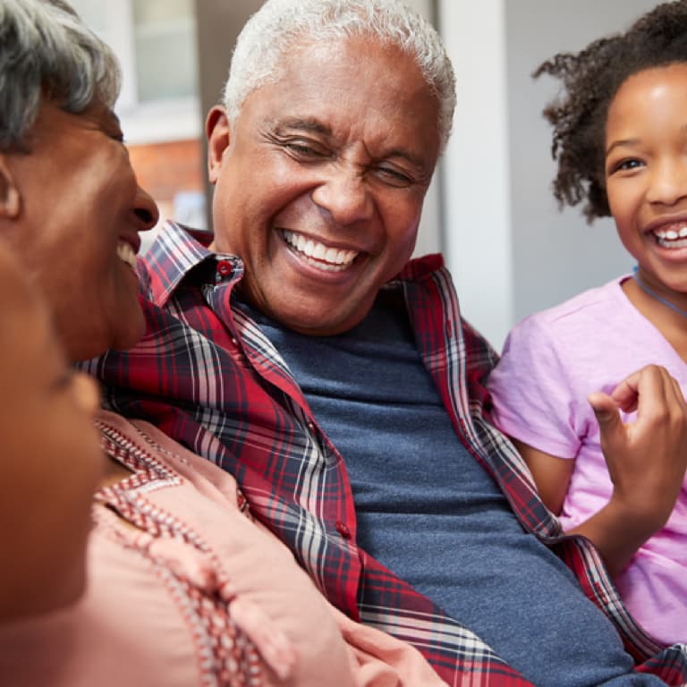 Happy grandfather and grandmother with their grandchild.
