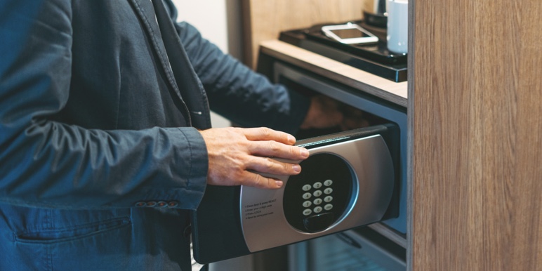 A professional Wills specialist putting an original Will into a safe-custody facility.