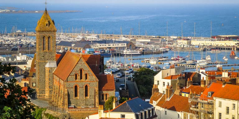 Aerial view of the Saint Peter Port at sunrise in Guernsey.