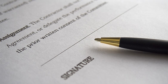 Unsigned Trust document with a pen placed on top of it.