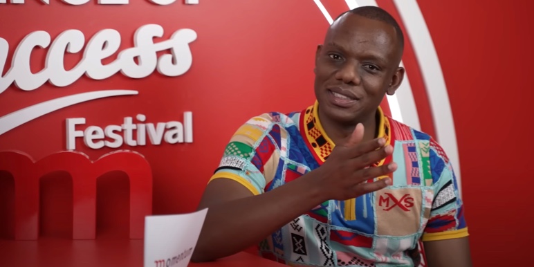 Slikour being interviewed at the Science of Success Festival 2023 on how he manages finances as a creative.