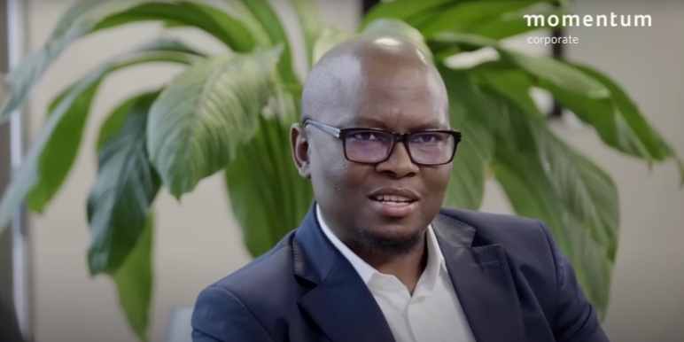 A Momentum Corporate branded image showing Tollo Nkosi in conversation for the Coffee Conversations webcast.