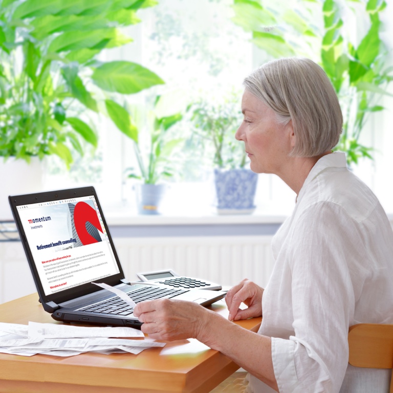 Elderly woman in a virtual consultation with a retirement benefit counsellor on her laptop