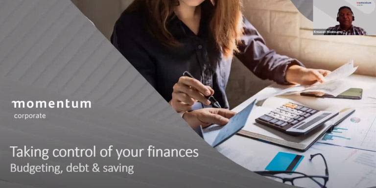 A young woman takes charge of her finances, sitting at a desk surrounded by budgets, spreadsheets, and a calculator, focused and determined.