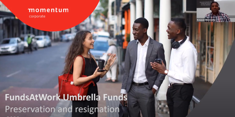 Three colleagues stand together, engaged in a discussion about the importance of preserving your retirement fund when resigning.