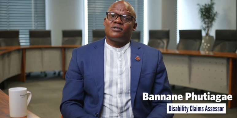 Colleagues discussing Momentum's lump sum disability benefit.

