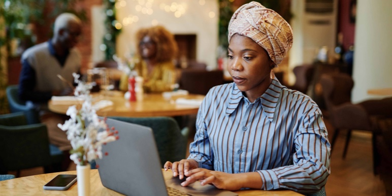 Woman researching her retirement options on a laptop.
