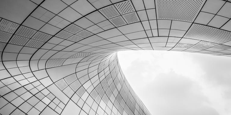 Low-angle view of the Zaha Hadid building.