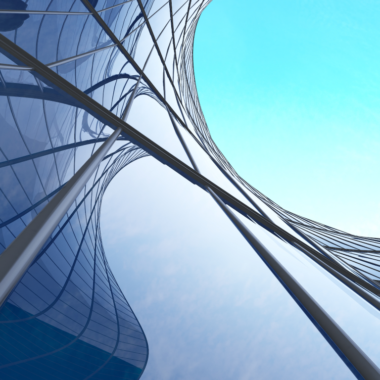 Low-angle view of futuristic high-rise curved glass building.