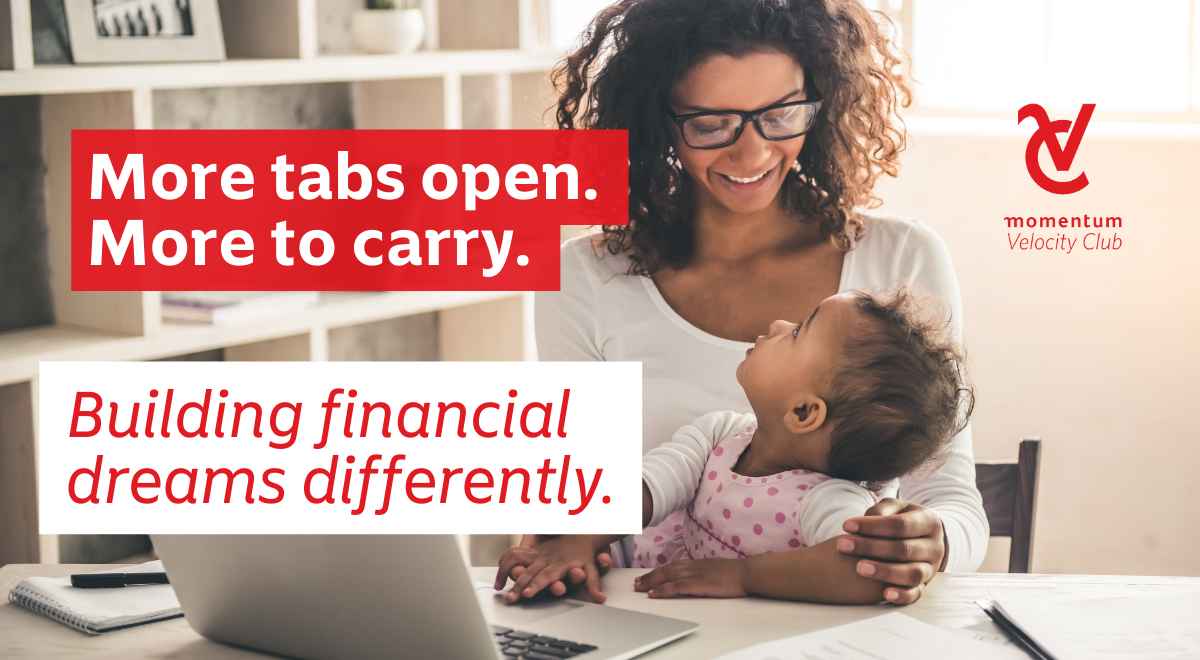 A female professional, sitting at a desk, in front of a laptop, attending to her child, while working from home.
 